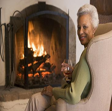 lady enjoying the fireplace