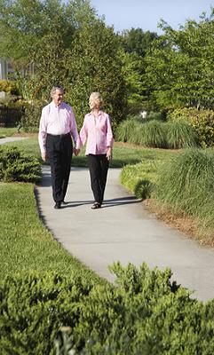 elderly couple out walking